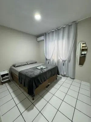 Uma cama ou camas num quarto em Apartamento dois quartos Aconchegante e bem localizado