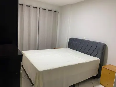 Uma cama ou camas num quarto em Apartamento Meia Praia