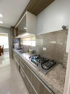 A cozinha ou kitchenette de Apartamento 4 suítes perto do mar