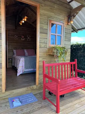 Uma cama ou camas num quarto em Chalé rústico no centro de Tijucas