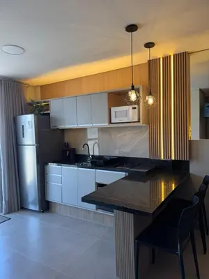 A cozinha ou kitchenette de Novo Studio a 4 Min da Praia de Palmas