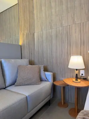 Uma área de estar em Novo Studio a 4 Min da Praia de Palmas