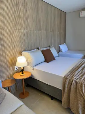 Uma cama ou camas num quarto em Novo Studio a 4 Min da Praia de Palmas