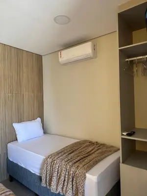 Uma cama ou camas num quarto em Novo Studio a 4 Min da Praia de Palmas