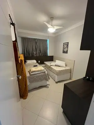 Uma cama ou camas num quarto em Apartamento próximo à praia e ao Hard Rock Café
