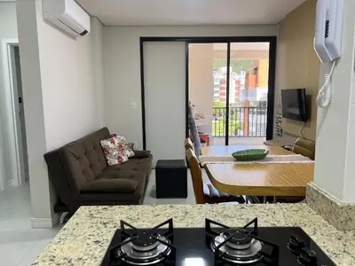 Uma televisão e/ou sistema de entretenimento em Lindo! Apto na praia de Palmas! AK01J