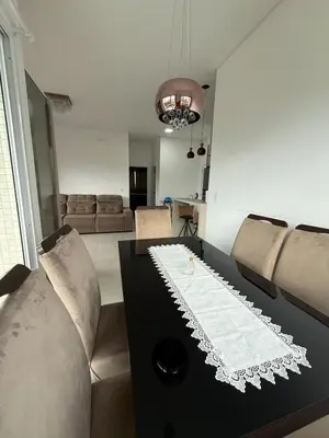 Uma área de estar em Apartamento Porto Belo SC, perto da praia