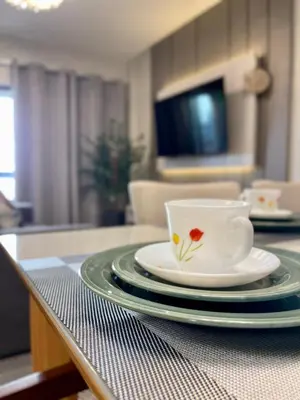 Uma televisão e/ou sistema de entretenimento em Casa Bella Mar - Apartamento Meia Praia