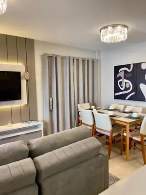 Uma área de estar em Casa Bella Mar - Apartamento Meia Praia
