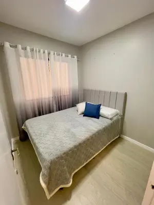 Uma cama ou camas num quarto em Casa Bella Mar - Apartamento Meia Praia