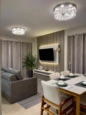 Uma televisão e/ou sistema de entretenimento em Casa Bella Mar - Apartamento Meia Praia