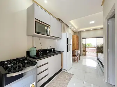 A cozinha ou kitchenette de LOFT SOL e MAR exclusivo em bombinhas, 50 metros do mar