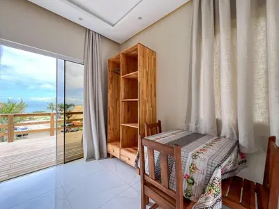 Uma cama ou camas num quarto em LOFT SOL e MAR exclusivo em bombinhas, 50 metros do mar
