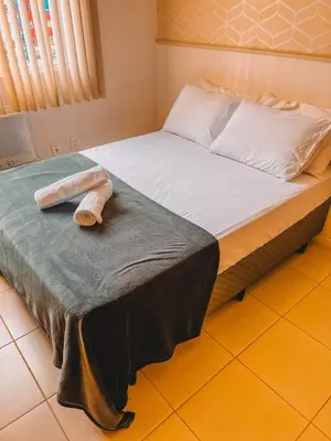Uma cama ou camas num quarto em Apartamento ao lado passeio são miguel- 400m Praia