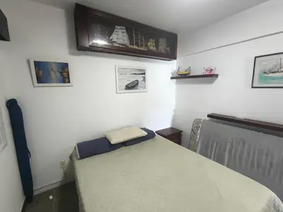 Uma cama ou camas num quarto em Apartamento 3 dormitórios frente mar