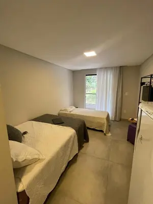Uma cama ou camas num quarto em Villa Parati Bombinhas