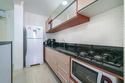 A cozinha ou kitchenette de Aluguel Apartamento 2 quartos vista mar Bombas/SC