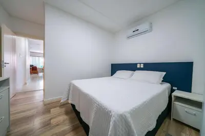 Uma cama ou camas num quarto em Aluguel Apartamento 2 quartos vista mar Bombas/SC