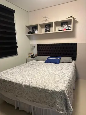 Uma cama ou camas num quarto em Leondina Soares Apartamento 403