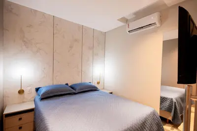Uma cama ou camas num quarto em Loft confortável em condominio com Piscina