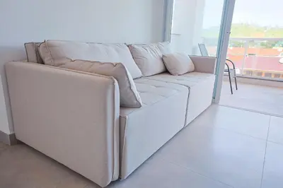 Uma área de estar em Condomínio Frente Mar com Piscina Climatizada