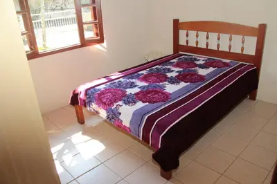 Uma cama ou camas num quarto em Residencial Aracuã