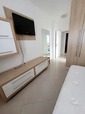 Uma cama ou camas num quarto em Excelente AP no Coração da Meia Praia