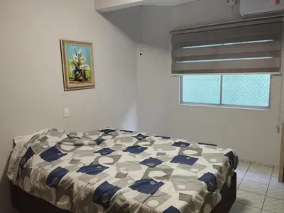 Uma cama ou camas num quarto em residencial ana paula