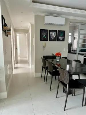 Uma área de estar em Apartamento na praia de Palmas à 200m do mar