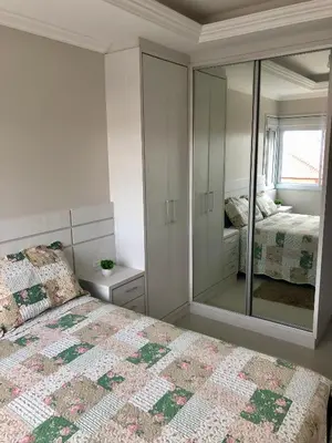 Uma cama ou camas num quarto em Apartamento na praia de Palmas à 200m do mar