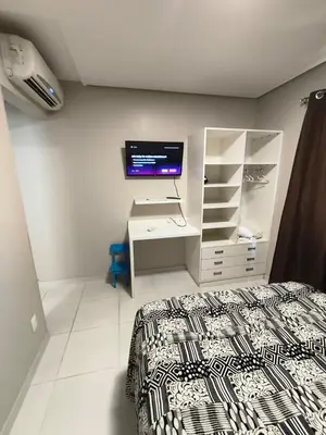 Uma cama ou camas num quarto em Alojamiento con excelente ubicación