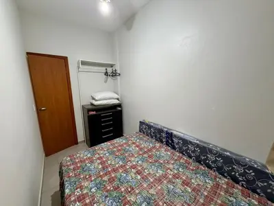 Uma cama ou camas num quarto em Confortável Apto Térreo a 185m da Praia Palmas 7