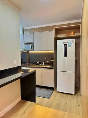 A cozinha ou kitchenette de Apartamento Temporada Itapema Meia Praia