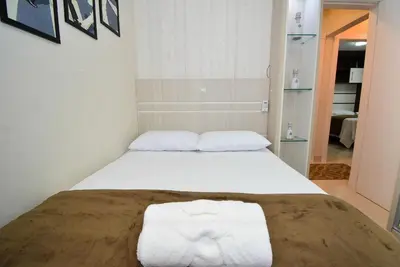 Uma cama ou camas num quarto em Aconchego em Itapema a 30 metros do Mar - ITA002
