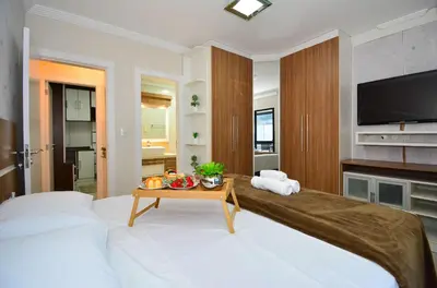 Uma cama ou camas num quarto em Aconchego em Itapema a 30 metros do Mar - ITA002