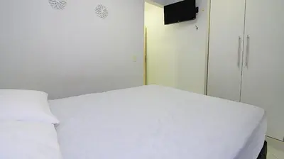 Uma cama ou camas num quarto em 1010 - Residencial Solar das Bromélias Apto 233