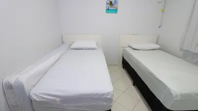 Uma cama ou camas num quarto em 1010 - Residencial Solar das Bromélias Apto 233