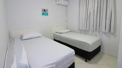 Uma cama ou camas num quarto em 1010 - Residencial Solar das Bromélias Apto 233
