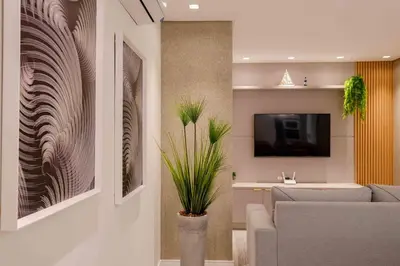 Uma televisão e/ou sistema de entretenimento em Apartamento Lindíssimo na Praia de Bombas
