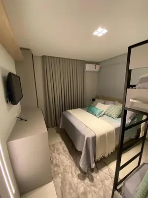 Uma cama ou camas num quarto em Excelente apartamento Frente Mar na Barra Sul