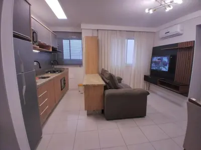 A cozinha ou kitchenette de Clube do Mar-rua 224-Itapema Meia Praia Apt 102 B