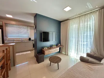 Uma televisão e/ou sistema de entretenimento em Apartamento no Residencial Toronto – Conforto e praticidade a poucos metros do mar!