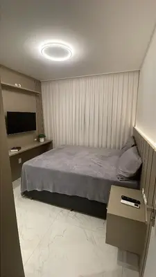 Uma cama ou camas num quarto em Apartamento Meia Praia - Itapema