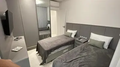 Uma cama ou camas num quarto em Apartamento Meia Praia - Itapema