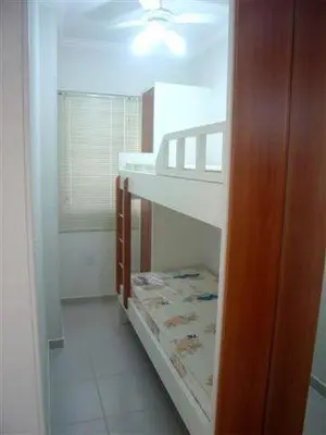 Uma cama ou camas num quarto em Clube do Mar-rua 224-Itapema Meia Praia Apt 201 A