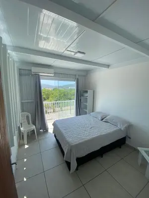 Uma cama ou camas num quarto em Departamento Crispim