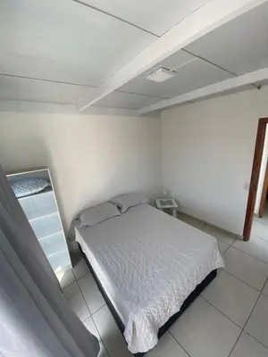 Uma cama ou camas num quarto em Departamento Crispim