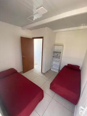 Uma cama ou camas num quarto em Departamento Crispim