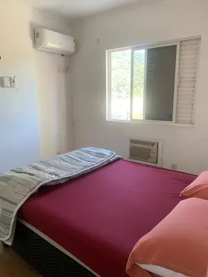 Uma cama ou camas num quarto em Apartamento Frente Mar Barra Sul