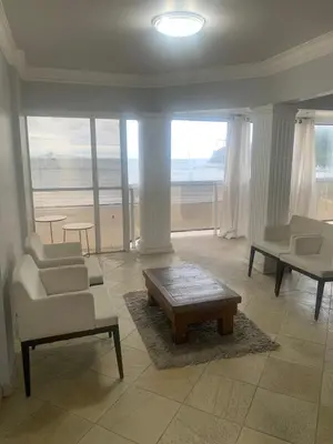 Uma área de estar em Apartamento Frente Mar Barra Sul